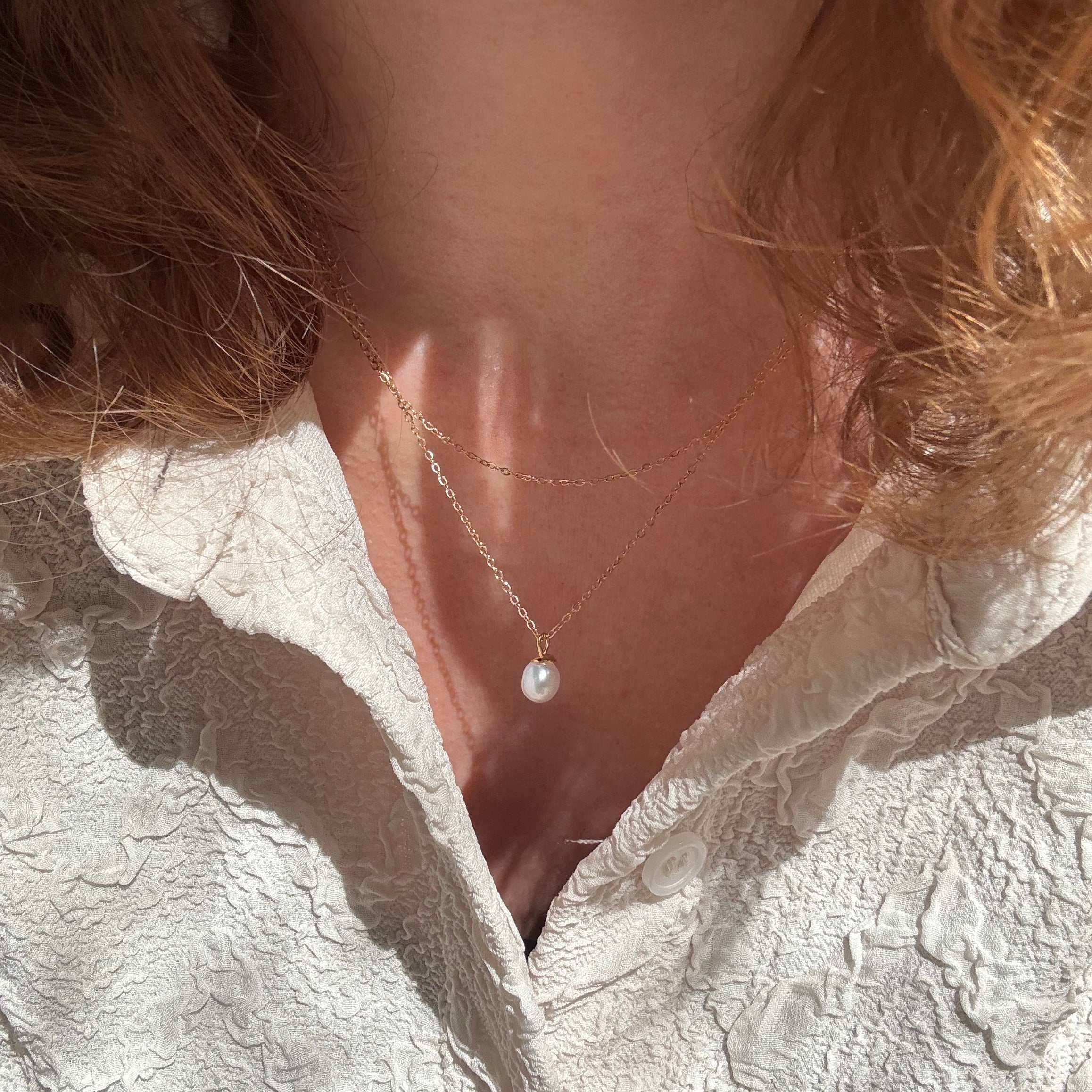 Perlekjede med dråpeanheng